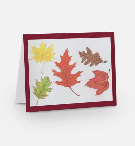 Greeting card with autumn leaf design on a white background