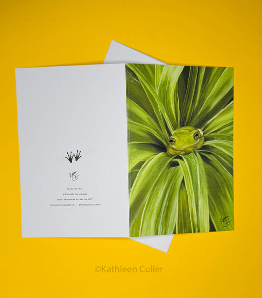 Greeting card with a frog design on a yellow background